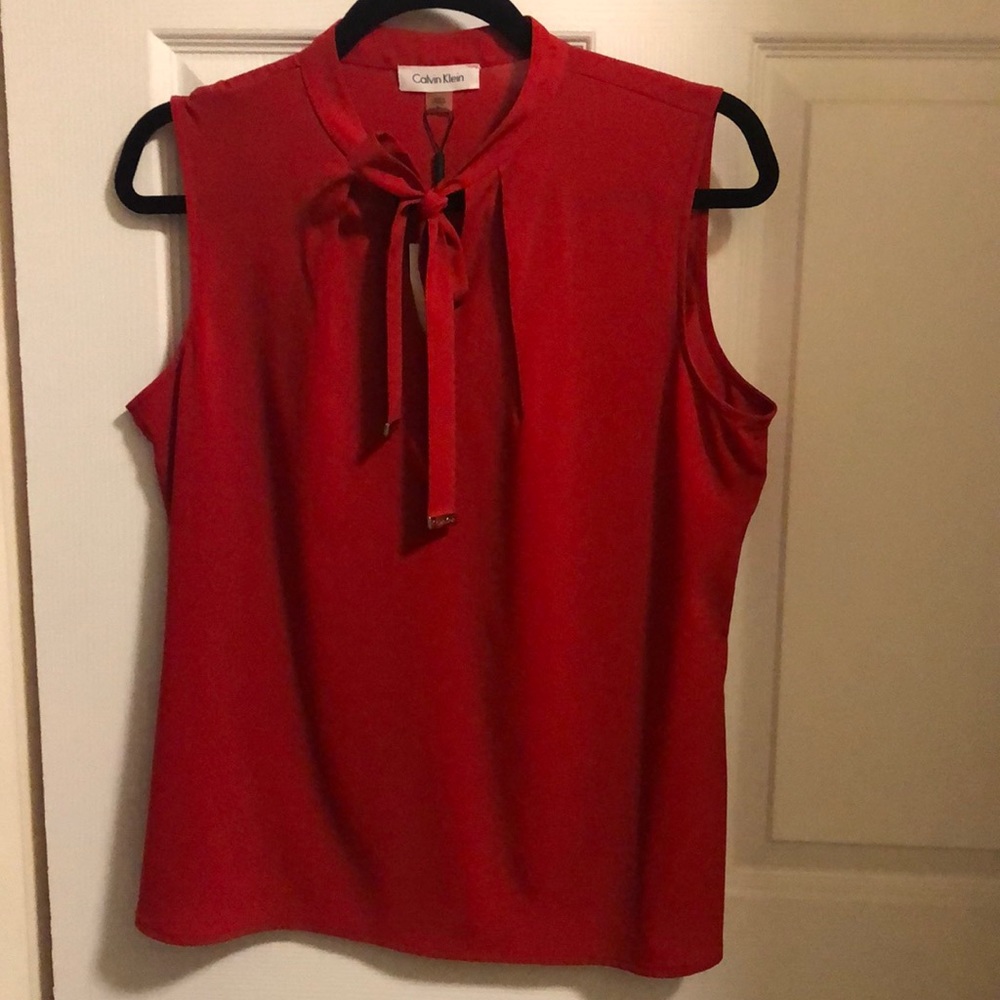 Beautiful red CK blouse (never worn)
